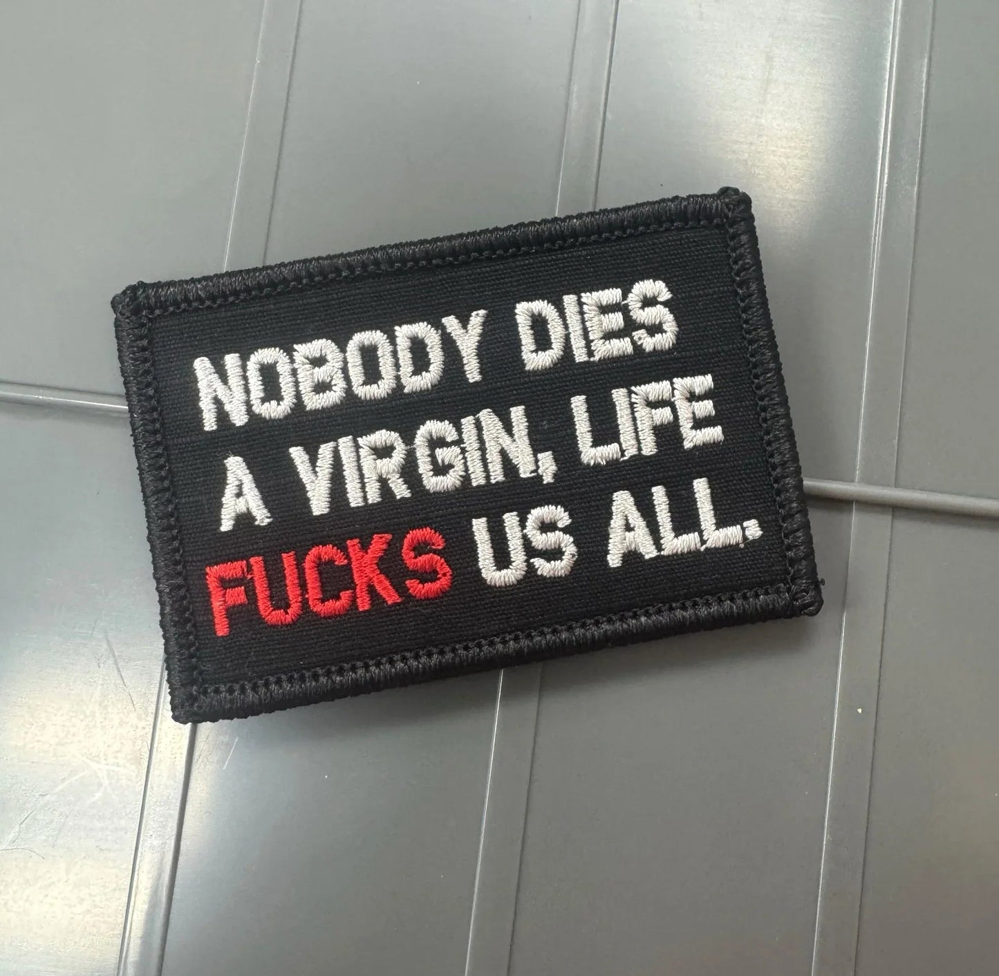 As Seen on Socials - Nobody Dies A Virgin, Life FUCKS Us All - Black w/Silver Tactical Gear Junkie