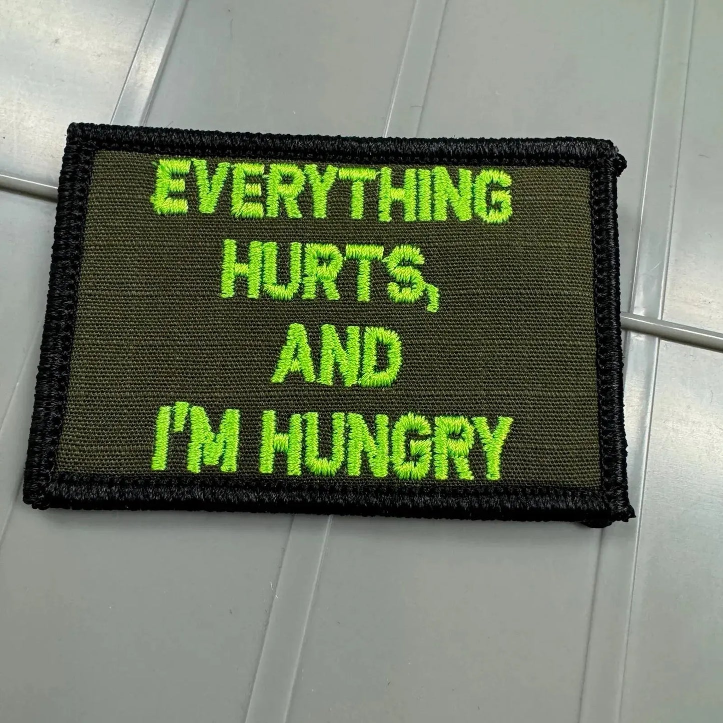 As Seen on Socials - Everything Hurts, And I'm Hungry - 2x3 Patch - Olive Drab w/Neon Green Tactical Gear Junkie