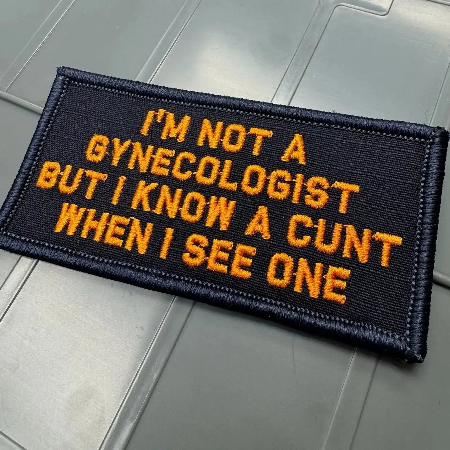 As Seen on Socials - I'm No Gynecologist But I Know A Cunt When I See One - 2x4 Patch - Navy w/Orange Tactical Gear Junkie